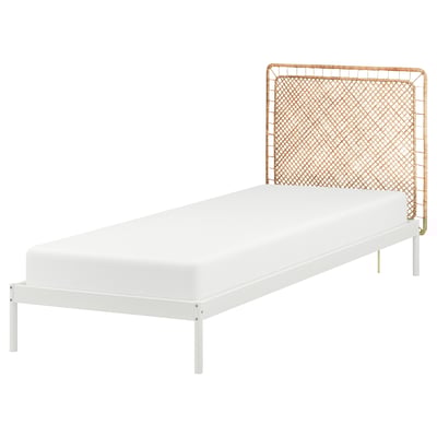 VEVELSTAD white metal single bed with natural rattan headboard.
