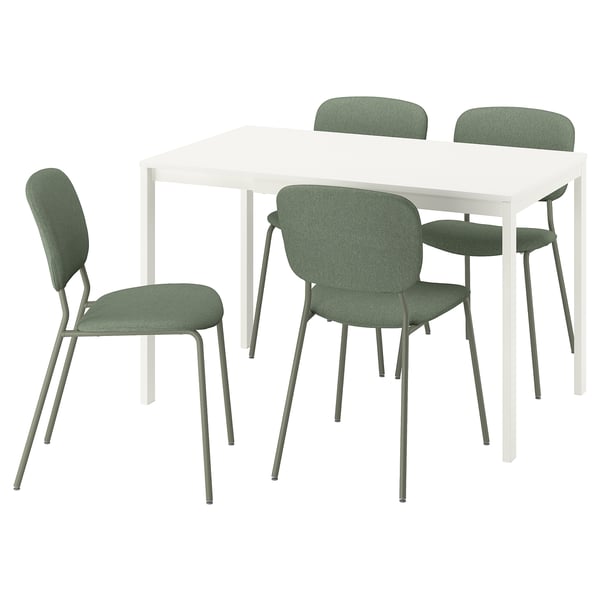 White square dining table with four green cushioned chairs.