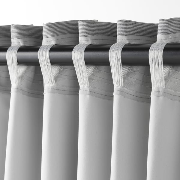 Grey VILBORG curtains with loops, insulating and blocking light for privacy.