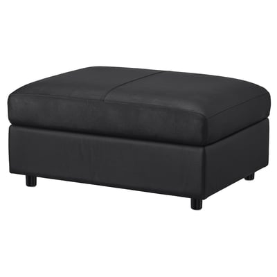Black VIMLE ottoman. Rectangular, upholstered in leather with dark legs. Storage footstool.