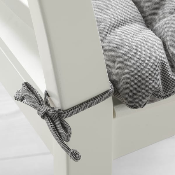 Grey and white chequered chair pad with tied strings for securing, offering thick cushiony comfort.