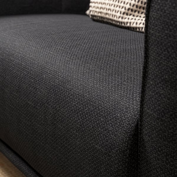 Deep black cushioned seat, soft & embracing, part of VISKAFORS armchair.