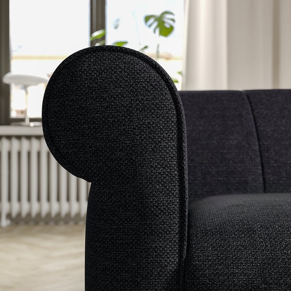 Black VISKAFORS armchair, round arm, tweed texture, deep seat, cosy design.