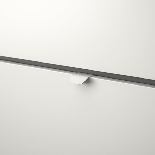 Black and white drawer handle; sleek, minimalist design.