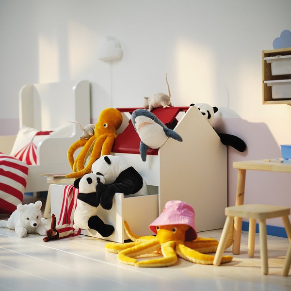 Kids room with white VITBJÖRN storage holding stuffed animals, clothes, and toys.