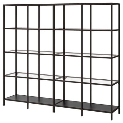 A VITTSJÖ shelf in black and glass. It has multiple compartments for storage, with an industrial, vintage design.