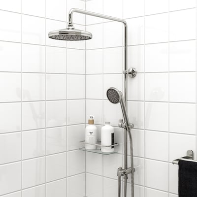 VOXNAN shower kit in chrome: hand/head sprayer, tiled wall, glass shelf, black towel.