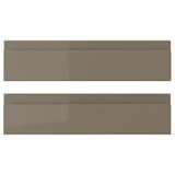 Two brown drawer fronts of VOXTORP design, sleek and modern with glossy finish and integrated handles.