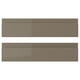 Two brown drawer fronts of VOXTORP design, sleek and modern with glossy finish and integrated handles.