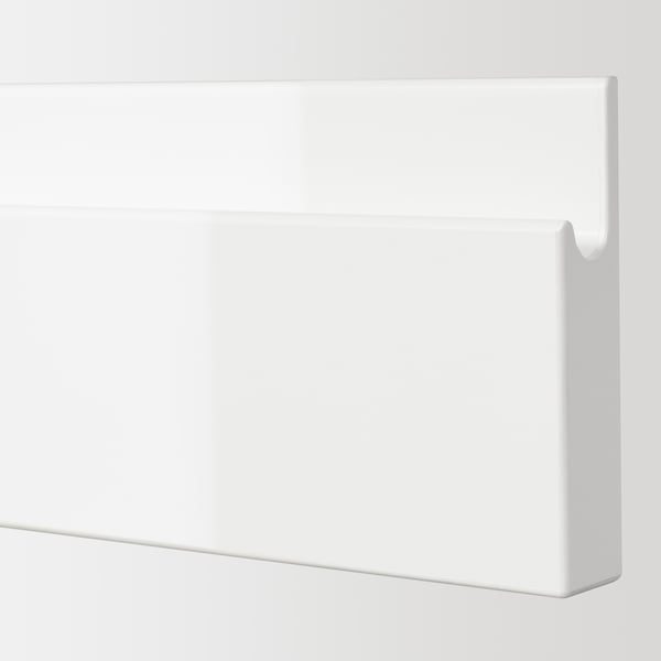 White glossy drawer front with smooth surface and integrated handle, showcasing modern design.