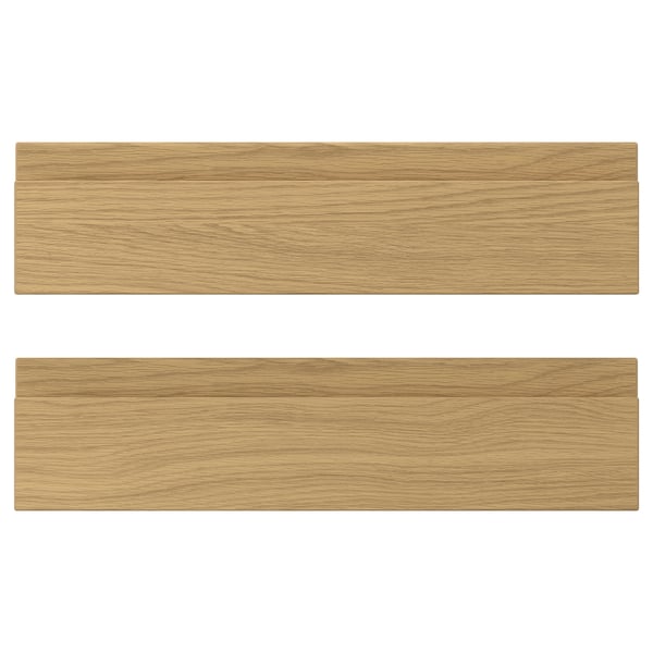 Two VOXTORP drawer fronts with an oak finish, featuring sleek, integrated handles.