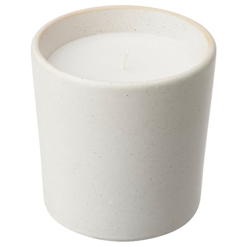 ADLAD scented candle in white ceramic jar. Round shape with speckled design, ideal for home decor.