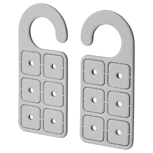Two grey, rectangular hangers with curved top hooks and six square holes with studs, uniform design, standing side by side.