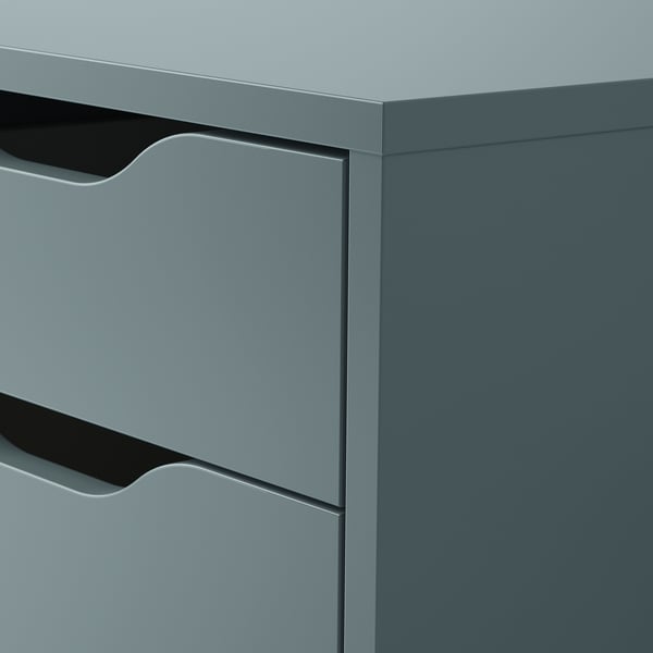 Close-up of modern grey drawer unit with smooth edges and handle cut-outs, showcasing quality design and craftsmanship.