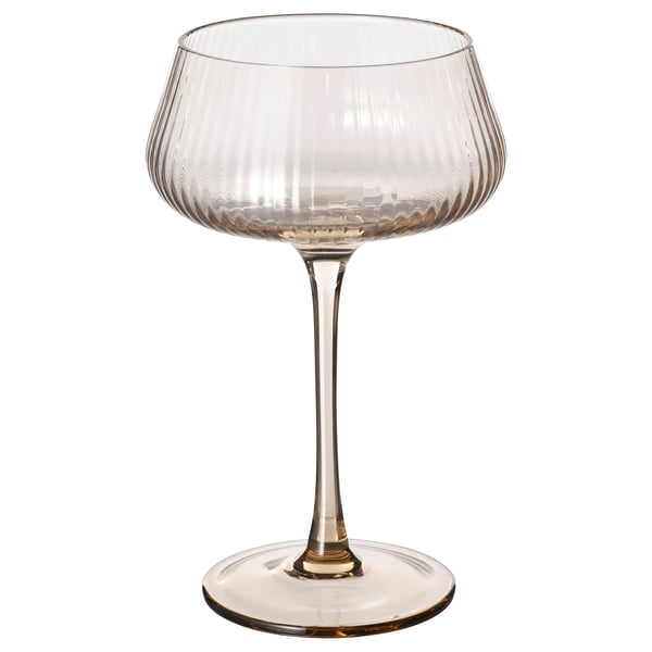 A tall, clear glass champagne coupe with a wide bowl and long stem. The design is elegant and sophisticated, ideal for serving champagne.