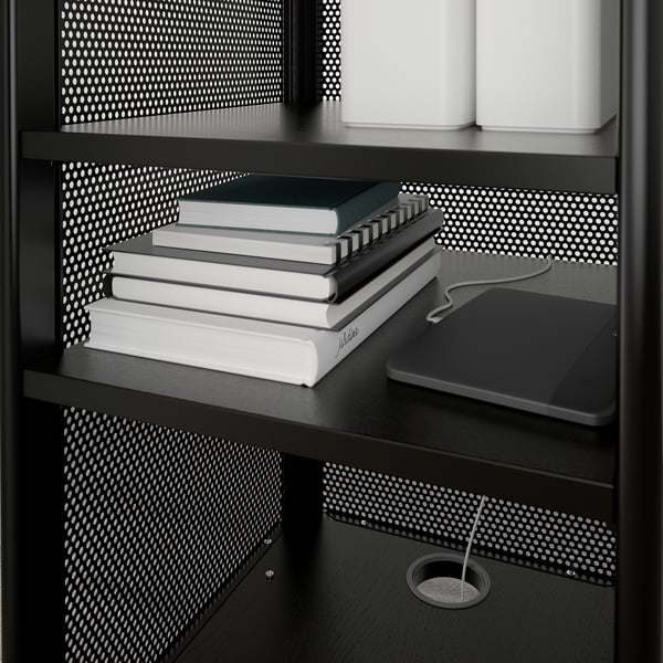 Black BEKANT mobile unit with books, a laptop, and boxes on shelves. Integrated cable management visible.