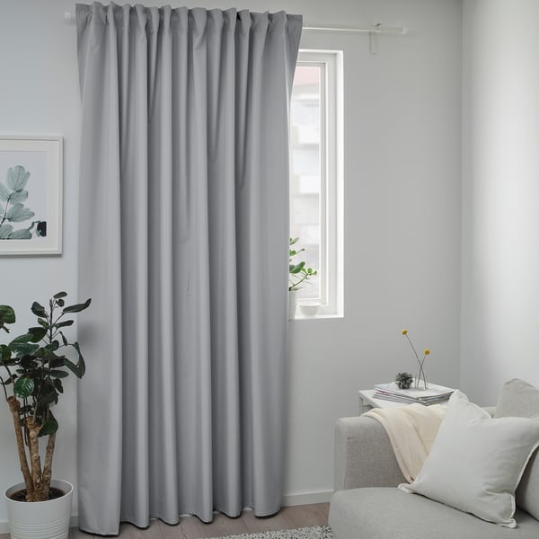 Grey BENGTA curtains, plant, art, couch in modern living room.
