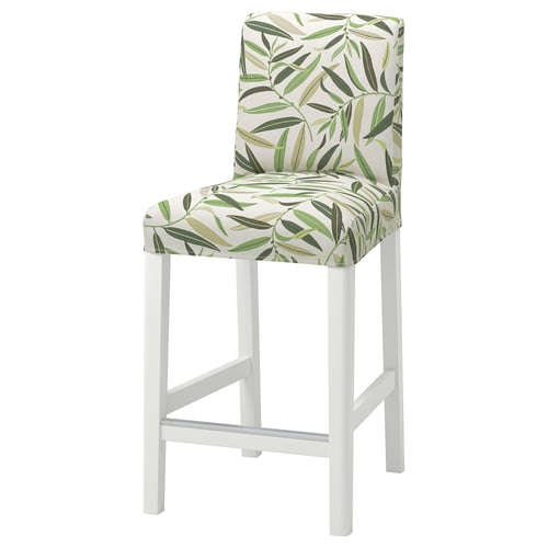 White bar stool with green leaf-patterned seat.