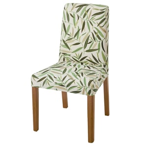 BERGMUND chair with green leaf pattern, white background, wooden legs, high back, elastic upholstery.
