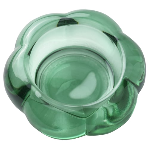 Green glass tealight holder, flower-shaped, modern design.