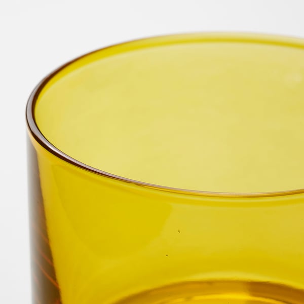 Bright yellow glass candle holder, smooth surface, simple design.