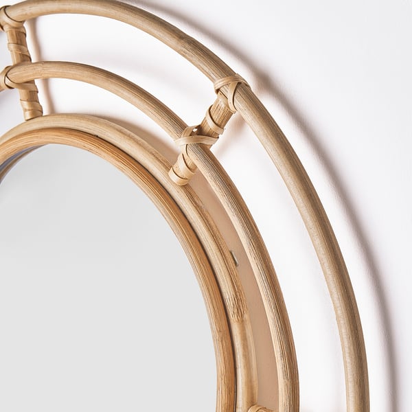 Rattan-framed mirror with natural texture and craftsmanship.