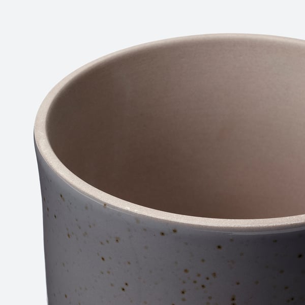 Close-up of a stylish, speckled grey BUSKKAPRIFOL planter, showcasing its smooth, durable stoneware texture.
