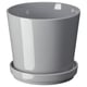 Grey stoneware planter with saucer, simple and modern design, suitable for indoor or outdoor plants.