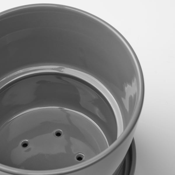 Large, minimalist grey stoneware planter with drain holes and matching saucer. Indoor/outdoor use.