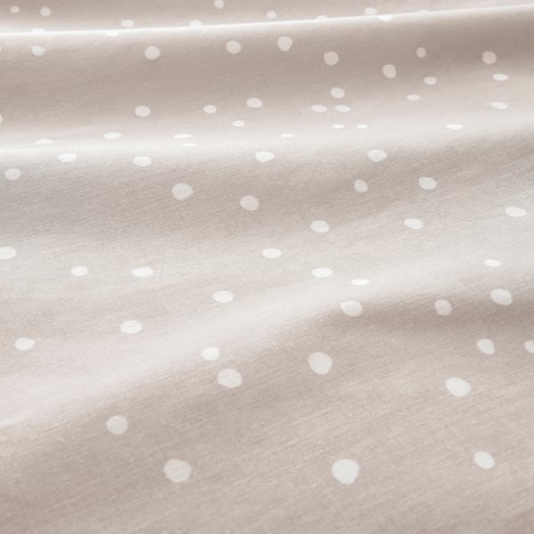 Beige cotton fabric with small white polka dots, tightly woven, soft feel.