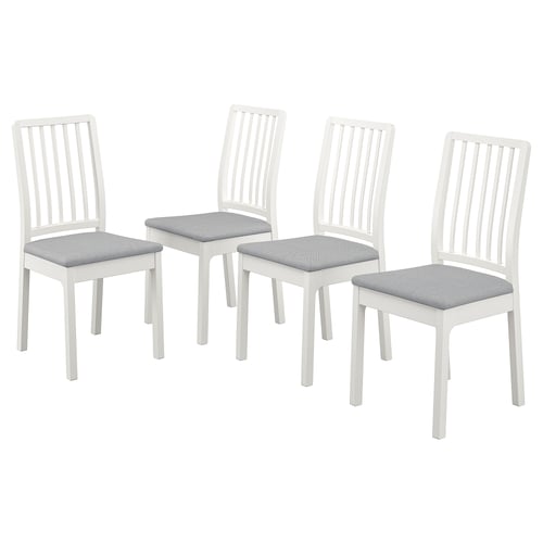 Four white wooden chairs with light grey cushions, arranged in a square. Simple design with vertical slats on back and legs.