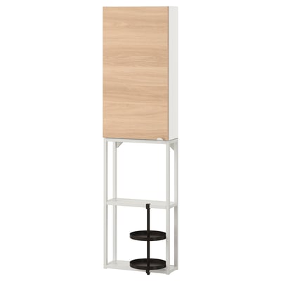 A white ENHET storage unit with light wood cabinet and three black shelves. Modern design, mix of open and closed storage.