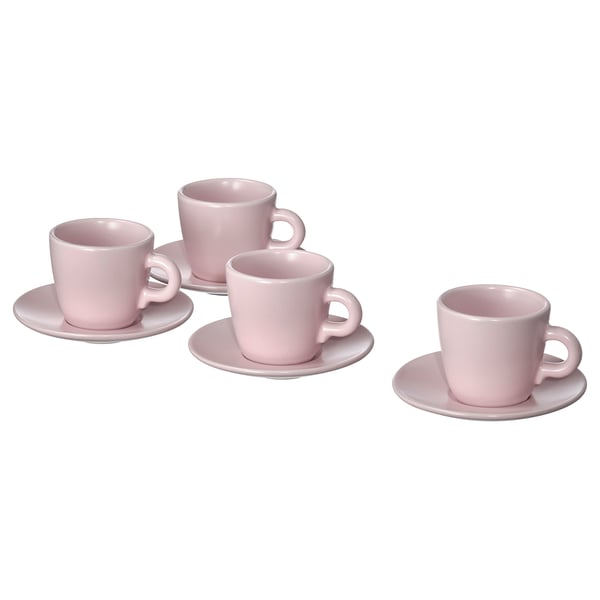 Four pink stoneware cups with handles and matching saucers; minimalist design.