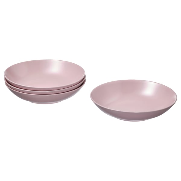 Four pink stoneware bowls, three stacked and one separate, with a simple, functional design.