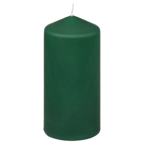Green FENOMEN candle, cylindrical shape, made of plant-based wax and paraffin, stands upright with a cotton wick.