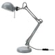 This image displays a grey FORSÅ adjustable desk lamp with a round base and a half-dome shade, crafted in steel with a powder-coated finish.