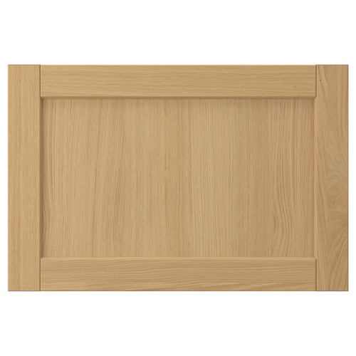 This image shows a FORSBACKA wooden cabinet door in natural oak colour, featuring a rectangular shape with bevelled edges and a classic design.