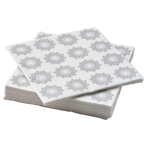 Stack of white star-patterned FRÖJDA napkins, made of absorbent three-ply paper.