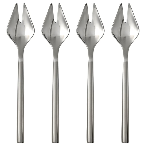 Four sleek silver forks, part of the FRÖJDA set, with clean lines and thin handles, arranged neatly for display.