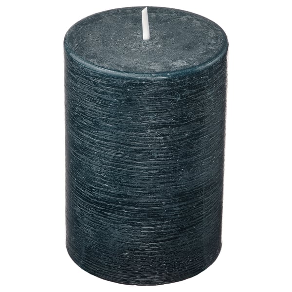 Dark green cylindrical scented candle with textured surface standing upright. Made from plant-based and paraffin wax.