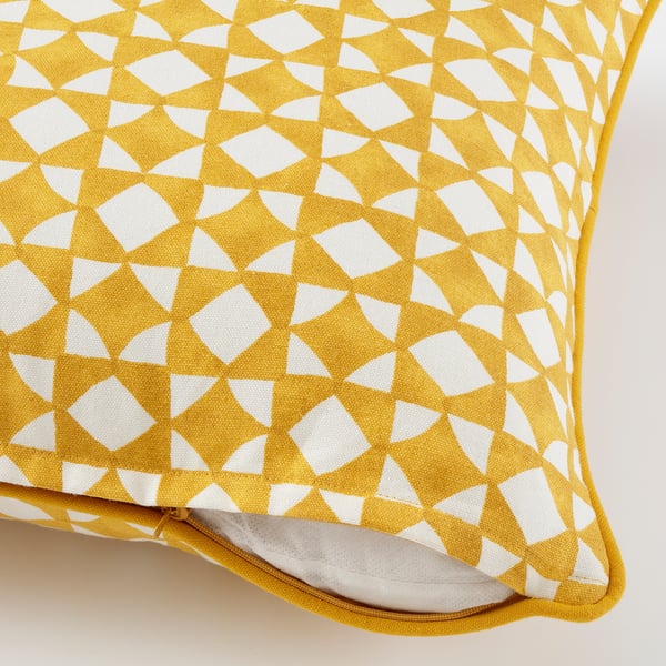 Yellow cushion cover with white geometric mosaic pattern, zip closure, and yellow piping detail.