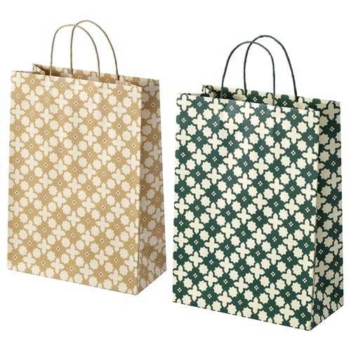 Two gift bags, one beige and one green, with floral patterns, paper material, rectangular shape and handles.
