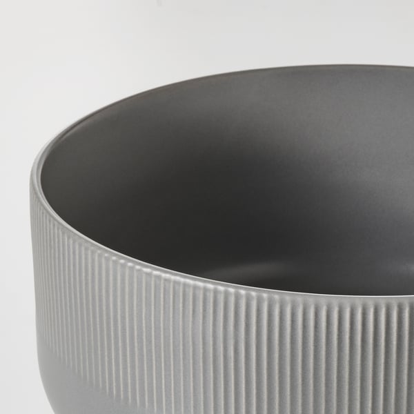 Sleek stoneware planter, dark grey with textured groove design, smooth finish.