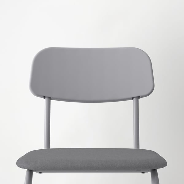 A modern grey chair with a sleek metal frame, cushioned seat for comfort, and a minimalist design.