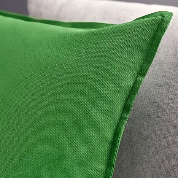 Bright green cushion cover, crisp texture, quality cotton.