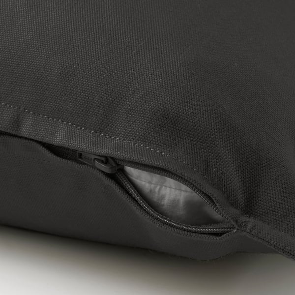 Close-up of GURLI cushion covers zip, showing easy access for washing.