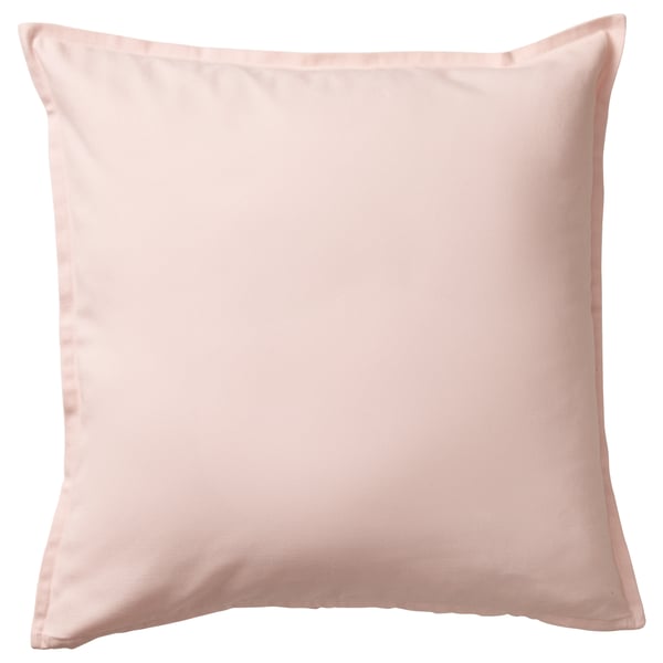 This image a square GURLI cushion cover in light pink. Its made of 100% cotton and has a simple, elegant design with a zip for easy removal.