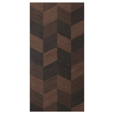 A rectangular HASSLARP door with a brown, black, & light wood herringbone pattern. Its sleek & modern, crafted from wood veneer.