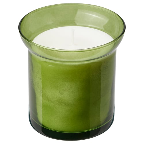 Green glass candle in round shape with smooth design, topped with white wick.