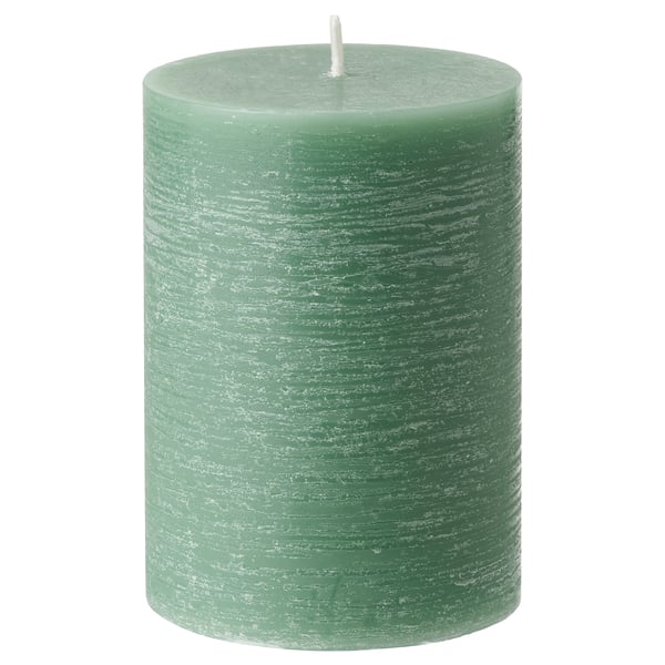 Green, cylindrical scented candle with a white wick, made from plant-based wax.